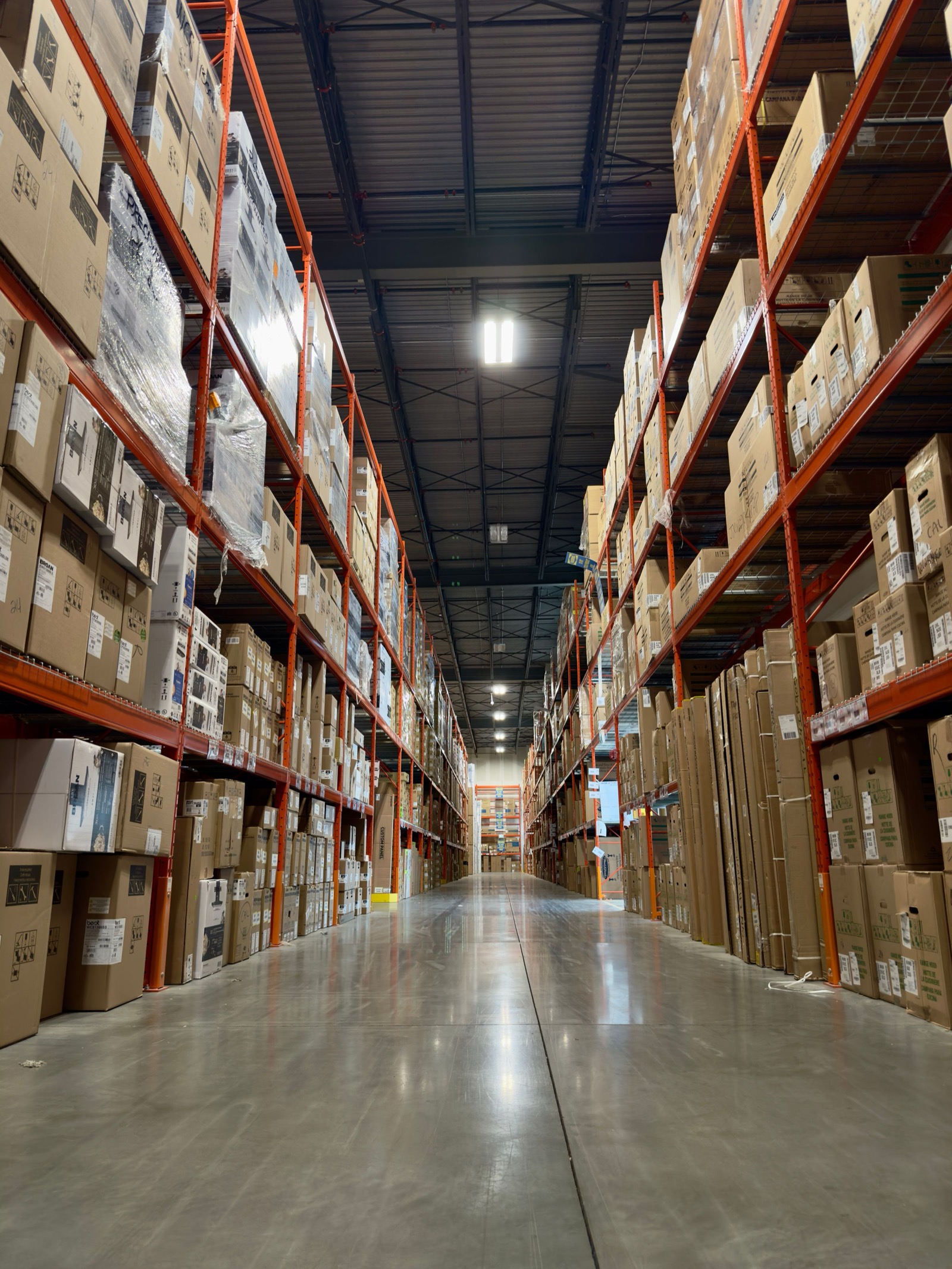 A large distribution warehouse receding into the distance